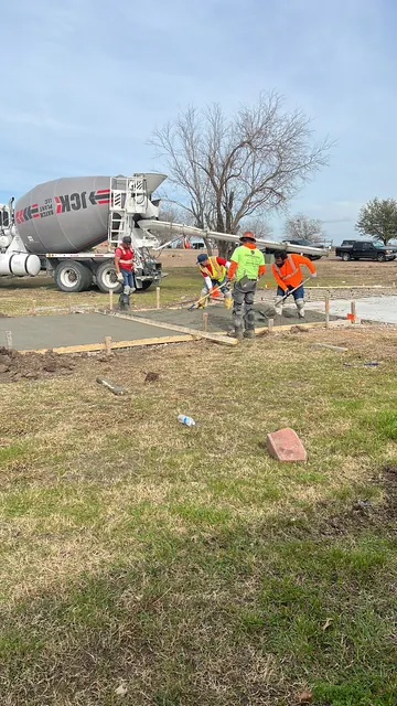 The crew working a pour alongside the mixer truck