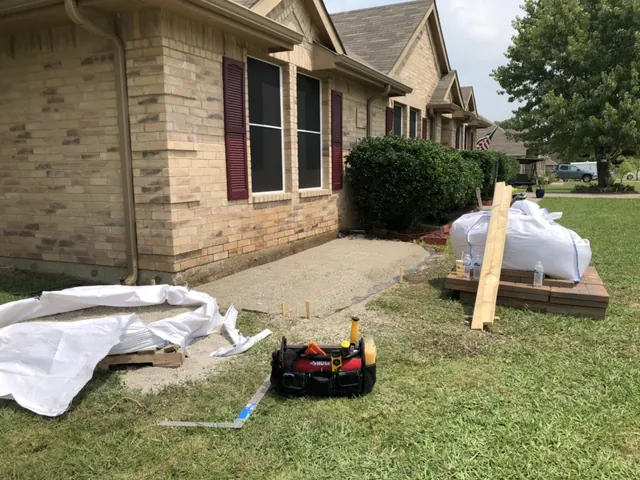 Materials staged at a brick home before the work starts