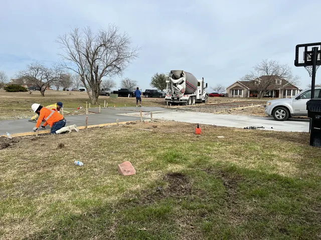 The crew setting up a pour with the mixer truck on site