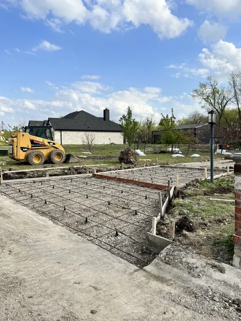 A formed pad with rebar in place, ready to pour
