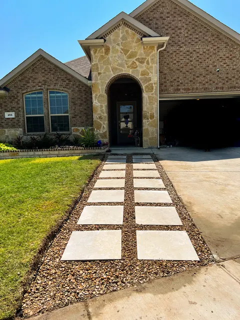A stepping-stone front walk set in gravel